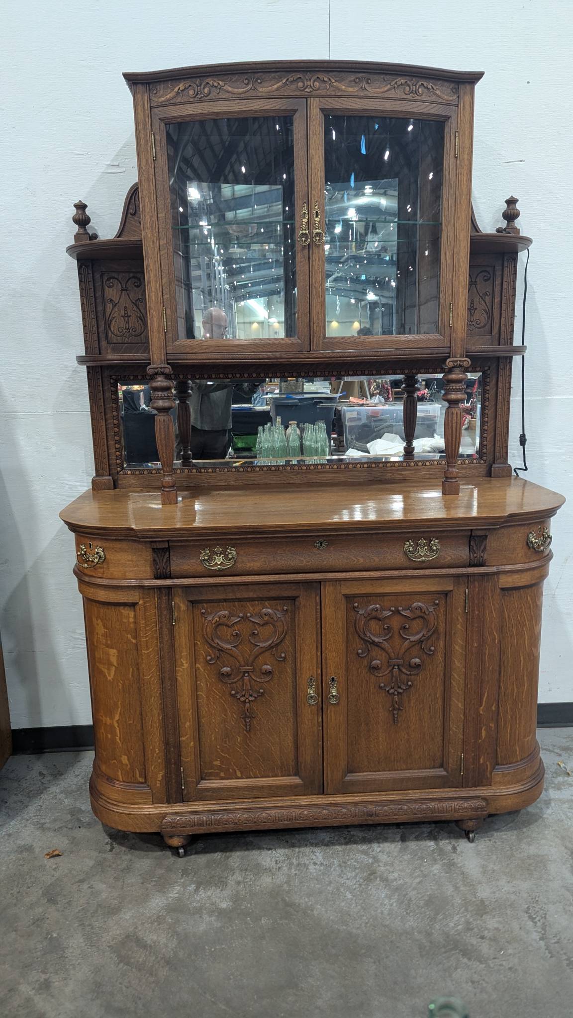 Antique Oak China Cabinet with Ornate Carved Details and Curved Glass Hutch