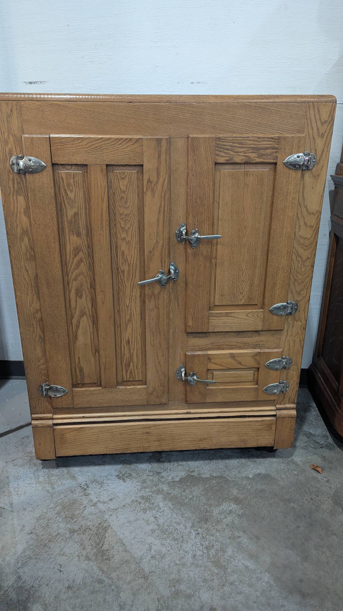 Antique Wooden Ice Box With Paneled Doors and Decorative Hardware