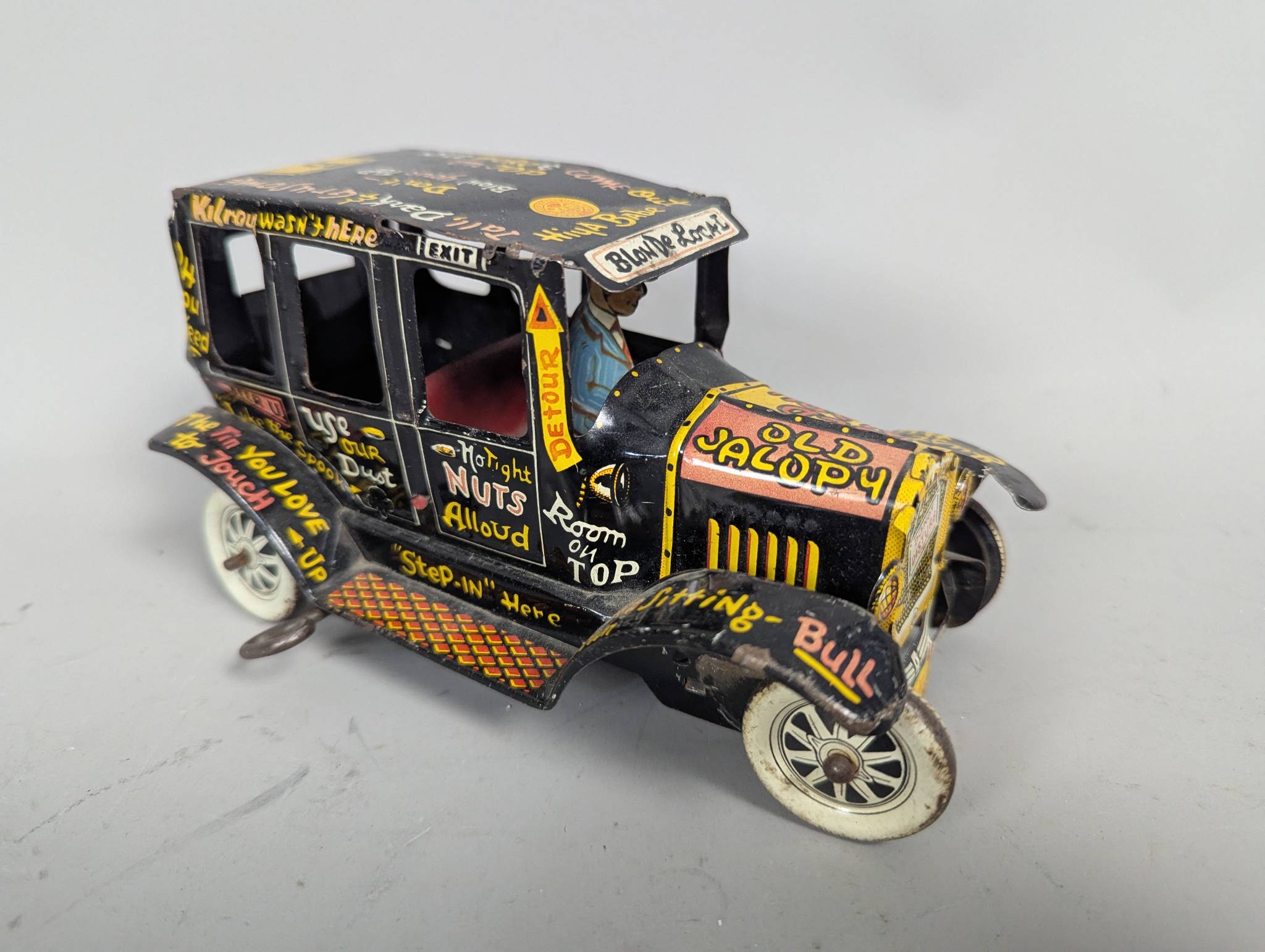 Marx Tin Lithographed Old Jalopy Wind-Up Toy Car with Driver Figurine