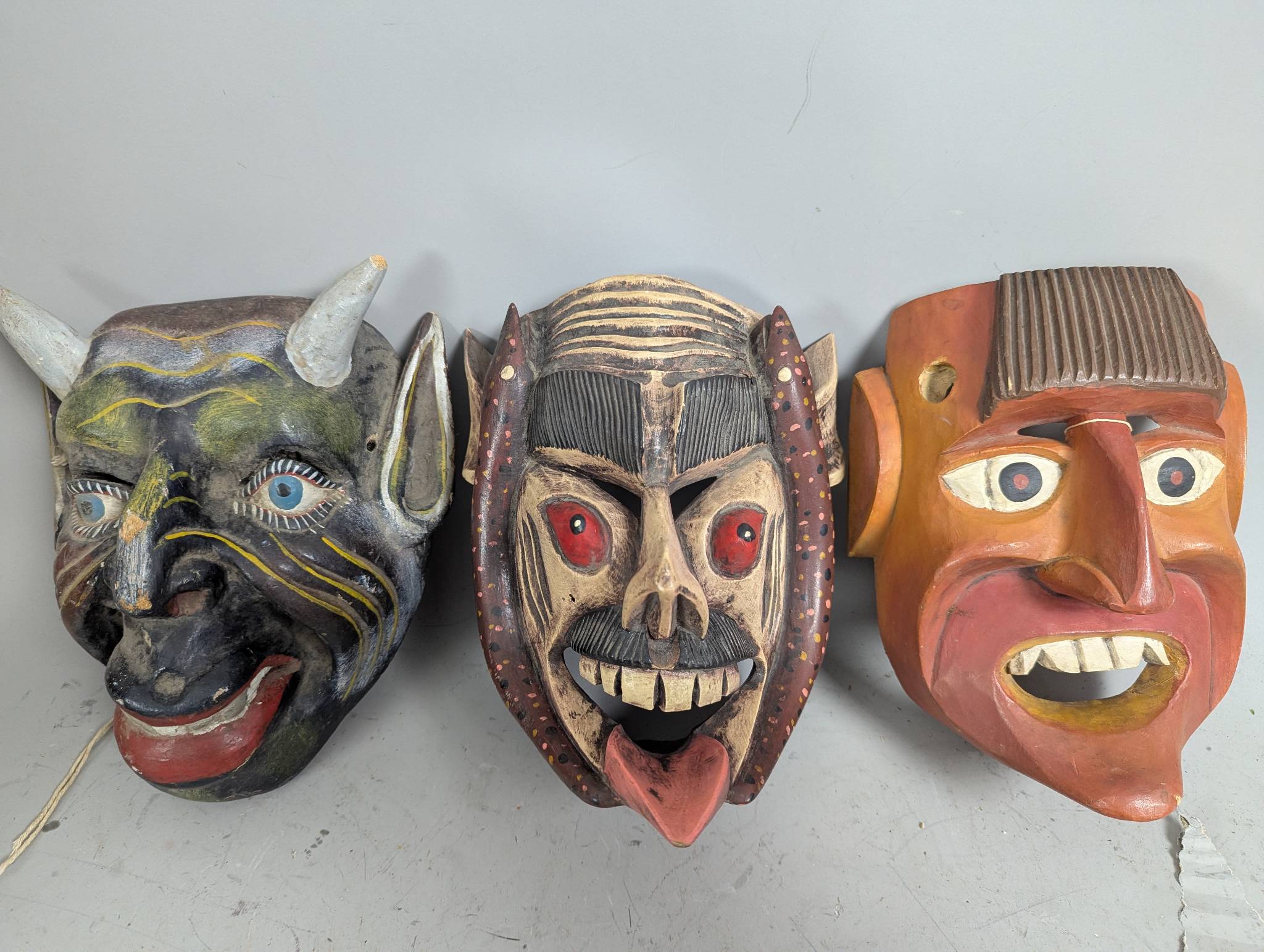 Three Carved Wood Mexican Festival Masks with Painted Designs