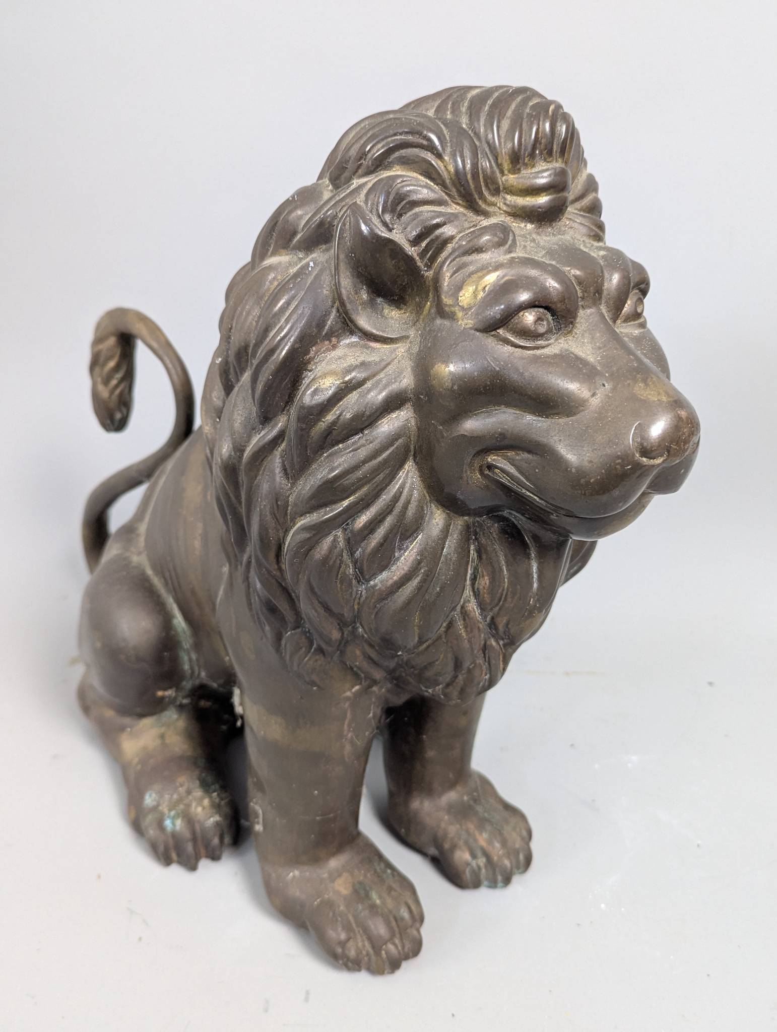 Antique Bronze Lion Sculpture With Patinated Finish